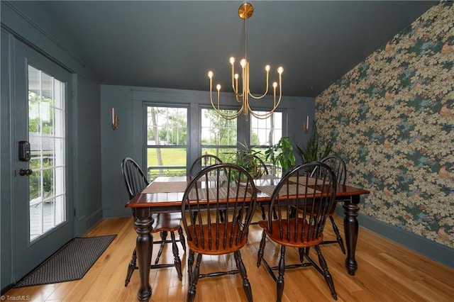 229 Orchard St, Mount Airy, NC 27030 - dining area with wallpapered walls, a chandelier, wood finished floors, and baseboards