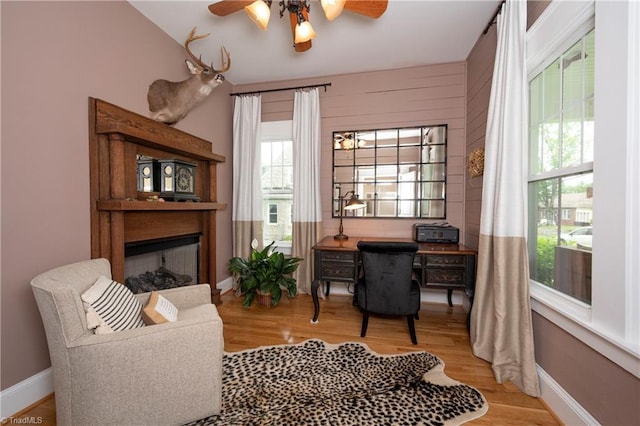 229 Orchard St, Mount Airy, NC 27030 - office space featuring a ceiling fan, wood finished floors, baseboards, and a fireplace