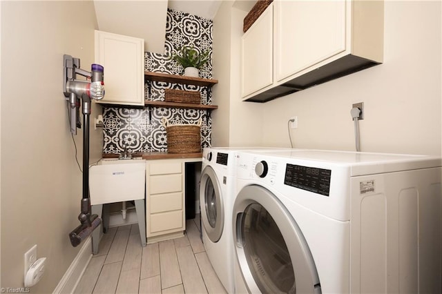229 Orchard St, Mount Airy, NC 27030 - washroom featuring cabinet space and independent washer and dryer