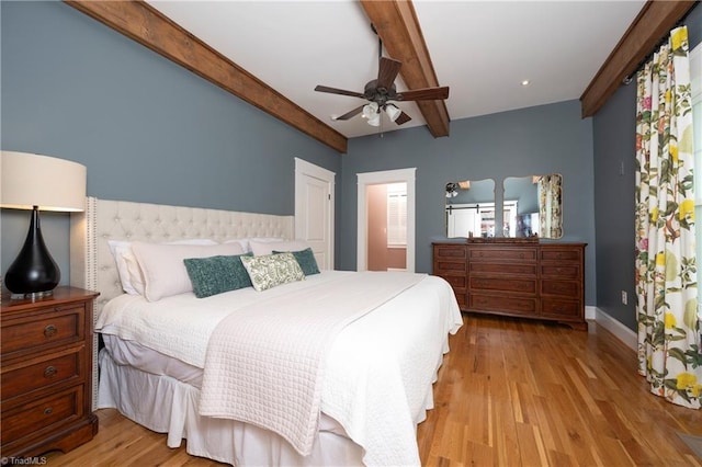 229 Orchard St, Mount Airy, NC 27030 - bedroom with beamed ceiling, light wood-style floors, baseboards, and a ceiling fan