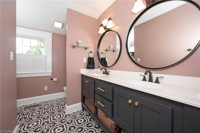 229 Orchard St, Mount Airy, NC 27030 - full bath with baseboards, double vanity, and toilet