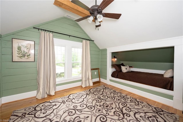 229 Orchard St, Mount Airy, NC 27030 - bedroom with lofted ceiling, baseboards, wood finished floors, wooden walls, and ceiling fan