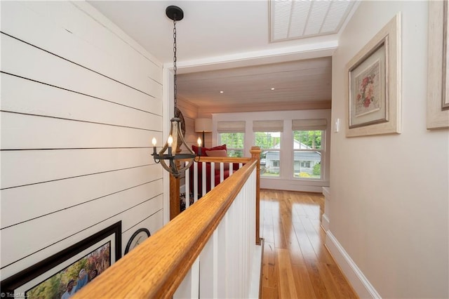 229 Orchard St, Mount Airy, NC 27030 - hallway with a chandelier, light wood-type flooring, an upstairs landing, baseboards, and ornamental molding