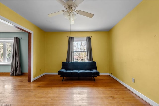 unfurnished room with ceiling fan and light hardwood / wood-style flooring