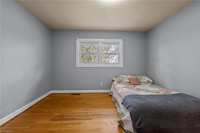 bedroom with light wood-type flooring