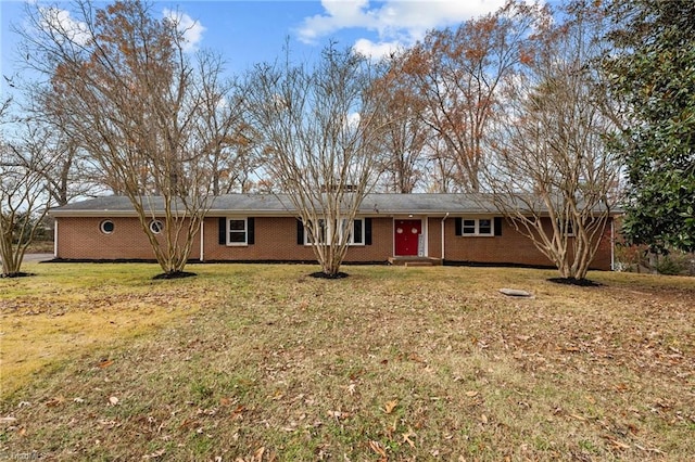 ranch-style home featuring a front yard