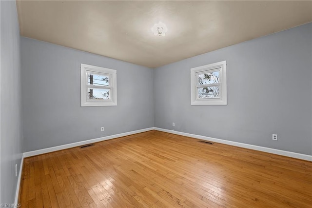 spare room with light wood-type flooring