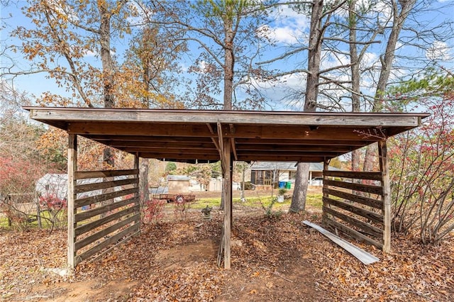 view of vehicle parking featuring a carport