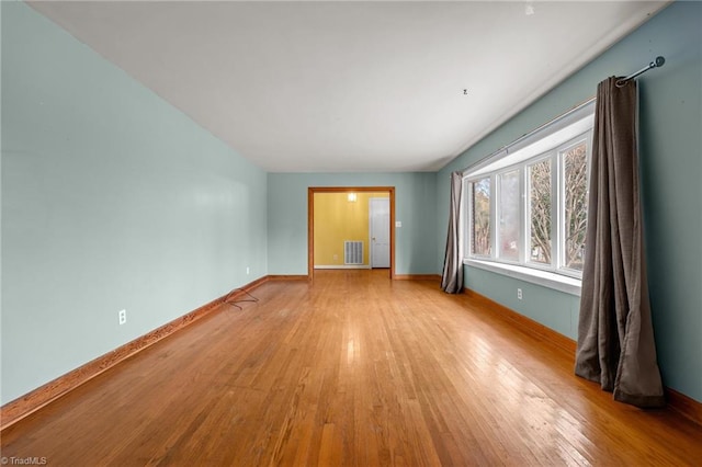 spare room featuring light wood-type flooring