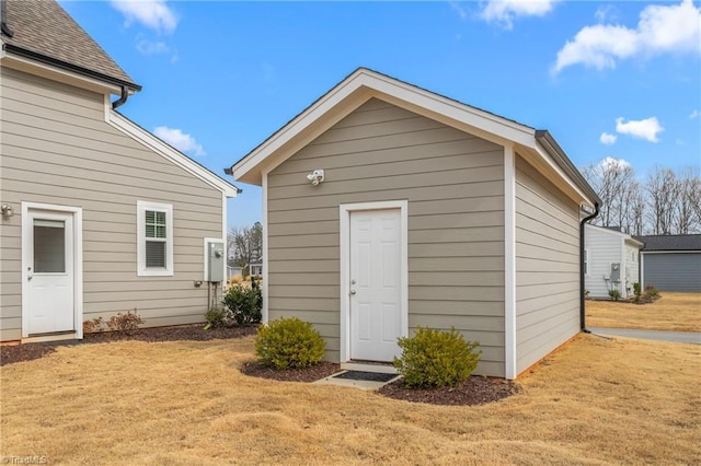 view of outbuilding with a lawn