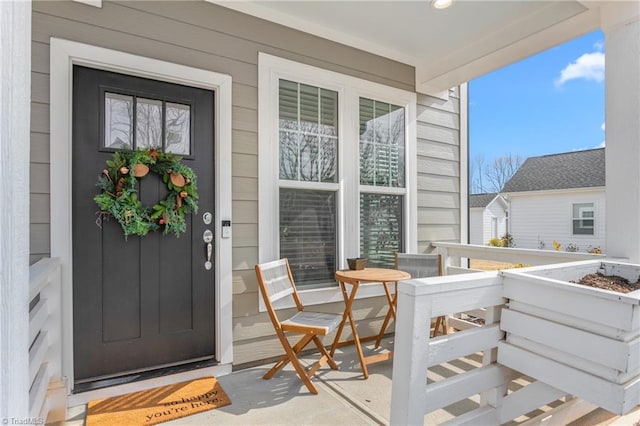 doorway to property featuring covered porch