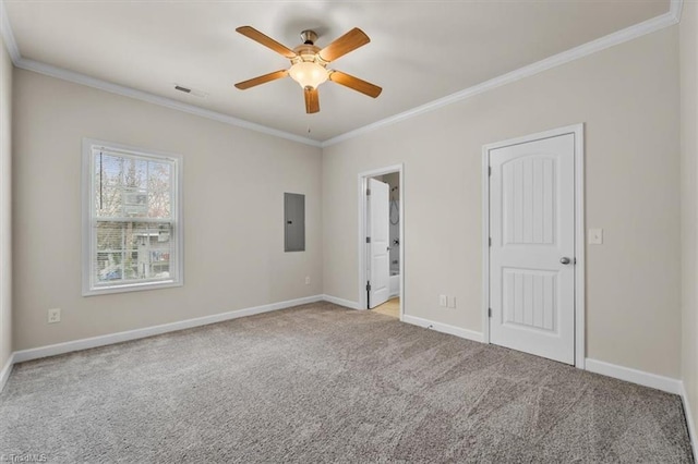 unfurnished bedroom with baseboards, visible vents, electric panel, ornamental molding, and carpet flooring