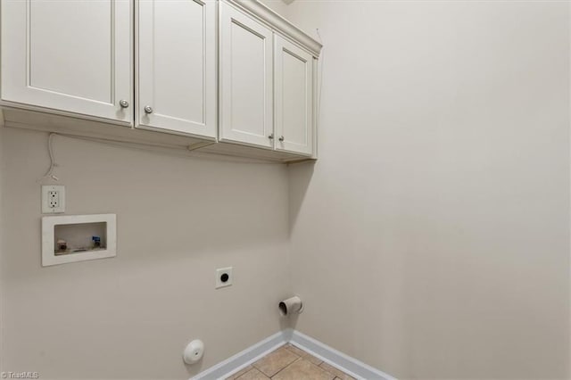 clothes washing area featuring hookup for a washing machine, baseboards, light tile patterned flooring, cabinet space, and electric dryer hookup