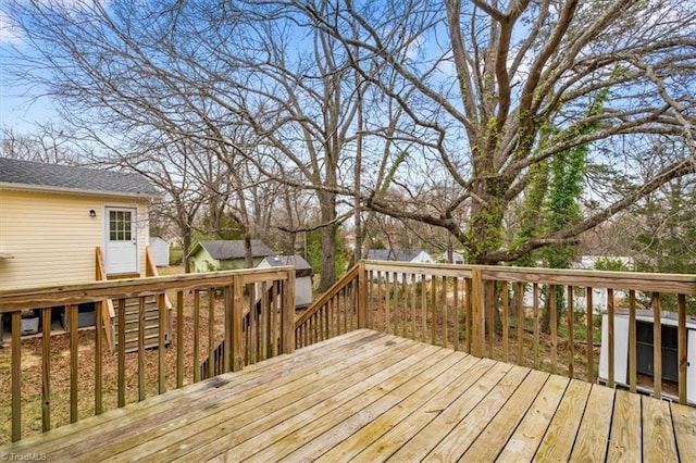 wooden deck with an outdoor structure