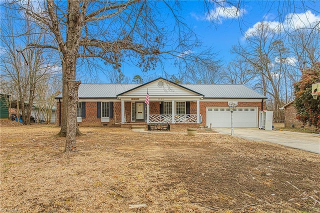 ranch-style home featuring a garage and covered porch