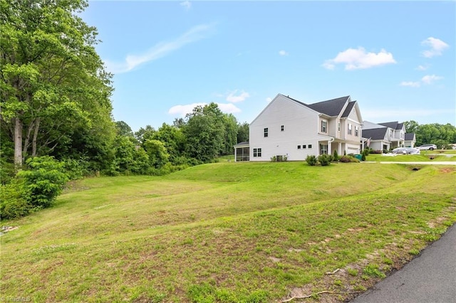 4928 Cranfill Ln, Walkertown, NC 27051 - view of side of home with a yard and an attached garage