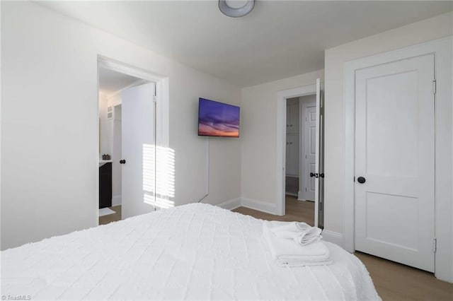 bedroom featuring hardwood / wood-style flooring