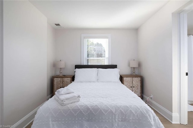 bedroom with light hardwood / wood-style flooring