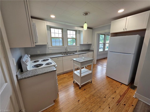 117 Hillcrest St, Jonesville, NC 28642 - kitchen with white appliances, light wood-style floors, white cabinetry, recessed lighting, and hanging light fixtures