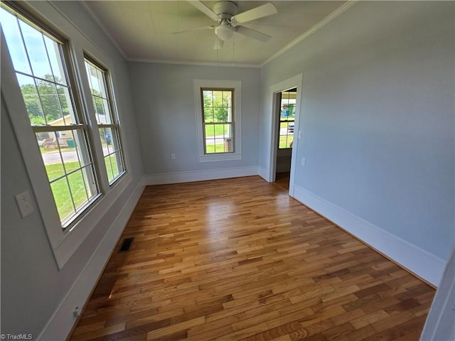 117 Hillcrest St, Jonesville, NC 28642 - empty room featuring crown molding, wood finished floors, and a ceiling fan