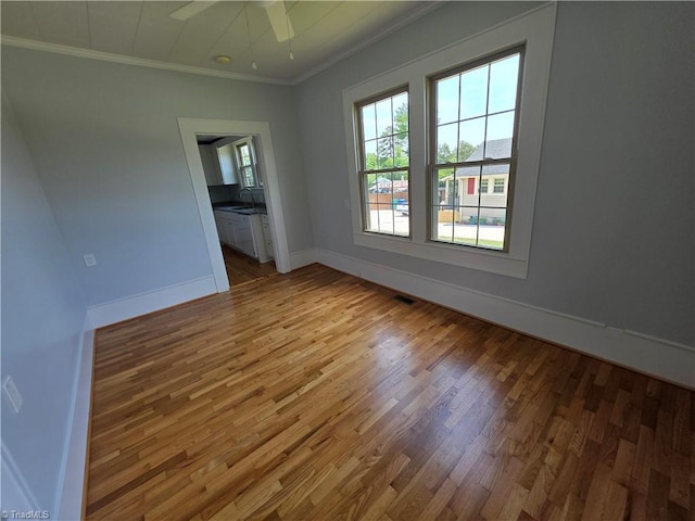 117 Hillcrest St, Jonesville, NC 28642 - unfurnished room featuring wood finished floors, ornamental molding, and a ceiling fan