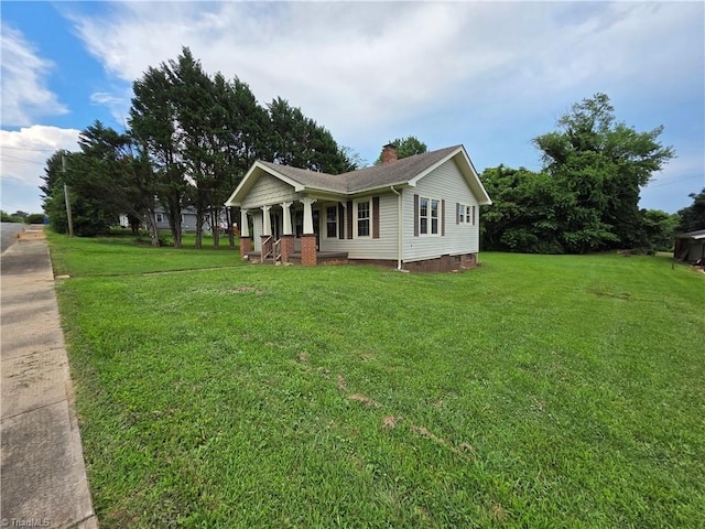 117 Hillcrest St, Jonesville, NC 28642 - ranch-style home featuring covered porch, a front yard, a chimney, and crawl space