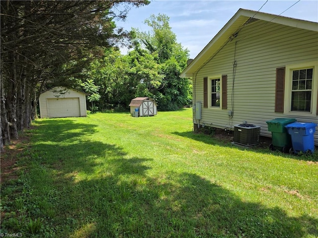 117 Hillcrest St, Jonesville, NC 28642 - view of green lawn with a garage and a shed