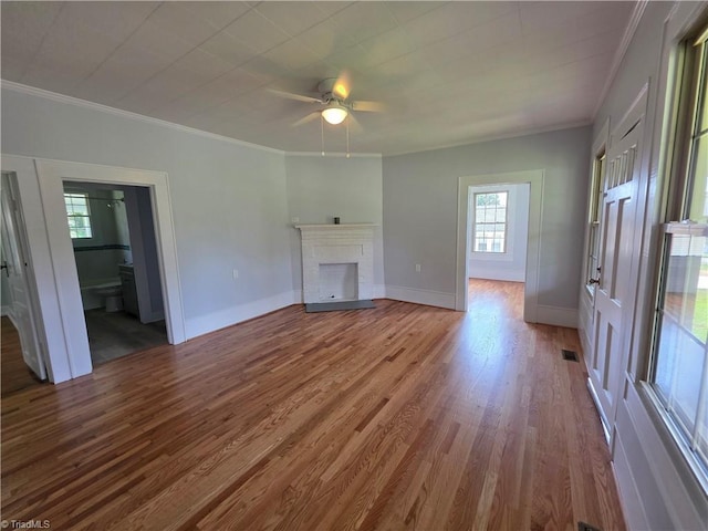 117 Hillcrest St, Jonesville, NC 28642 - unfurnished living room featuring wood finished floors, ornamental molding, a fireplace, and a ceiling fan