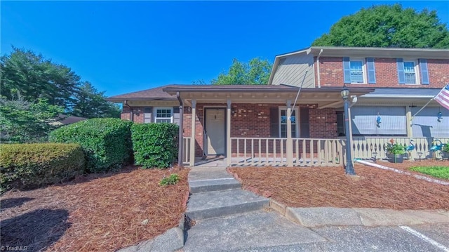 3128 Burke Mill Ct, Winston-Salem, NC 27103 - view of front of house with covered porch and brick siding