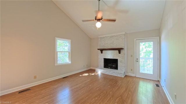 3128 Burke Mill Ct, Winston-Salem, NC 27103 - unfurnished living room with wood finished floors, ceiling fan, a fireplace, and high vaulted ceiling
