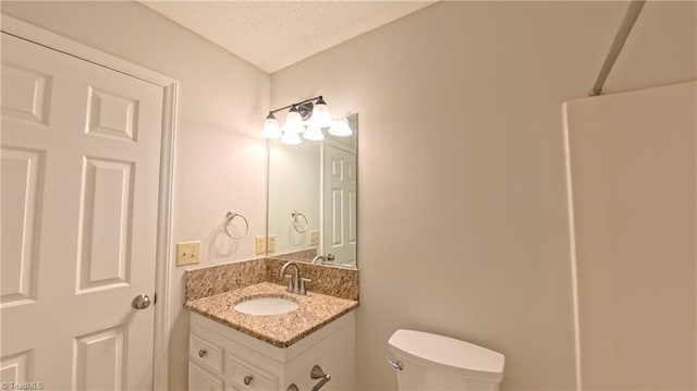 3128 Burke Mill Ct, Winston-Salem, NC 27103 - bathroom with vanity and a textured ceiling