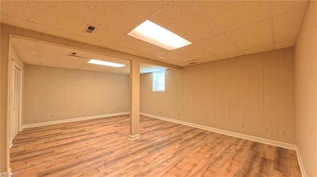 3128 Burke Mill Ct, Winston-Salem, NC 27103 - below grade area featuring light wood-style flooring and a drop ceiling