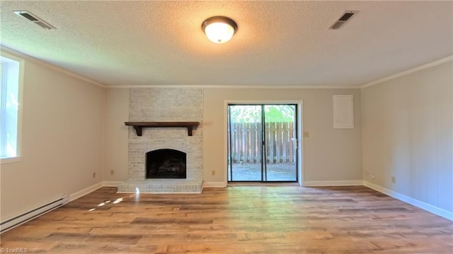 3128 Burke Mill Ct, Winston-Salem, NC 27103 - unfurnished living room with a baseboard radiator, wood finished floors, ornamental molding, a brick fireplace, and a textured ceiling