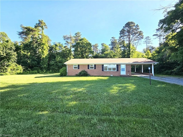 ranch-style home with a carport and a front yard