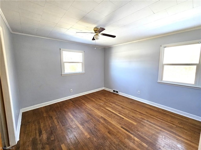 unfurnished room featuring ceiling fan, wood-type flooring, and crown molding