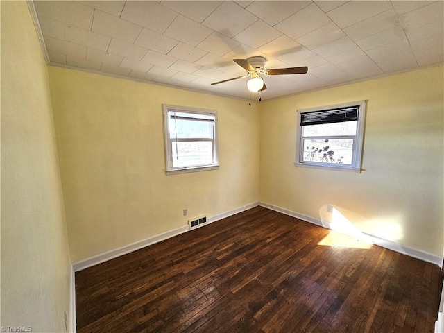 spare room with dark wood-type flooring