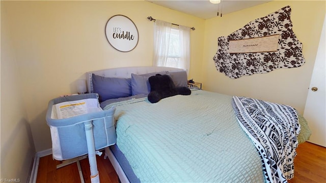 bedroom with hardwood / wood-style flooring