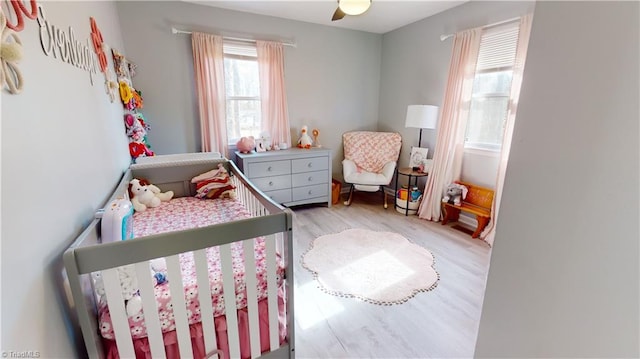 bedroom featuring ceiling fan and light wood-type flooring