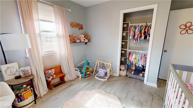 bedroom with light hardwood / wood-style floors