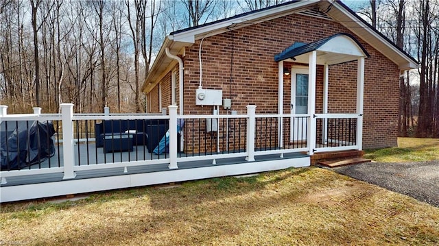 view of property exterior with a wooden deck