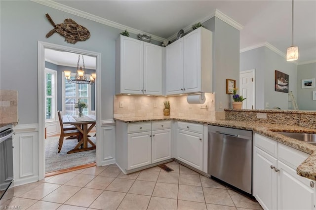 kitchen with dishwasher, a chandelier, ornamental molding, light stone counters, and white cabinets
