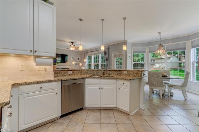 kitchen with dishwasher, a sink, light tile patterned floors, backsplash, and ornamental molding