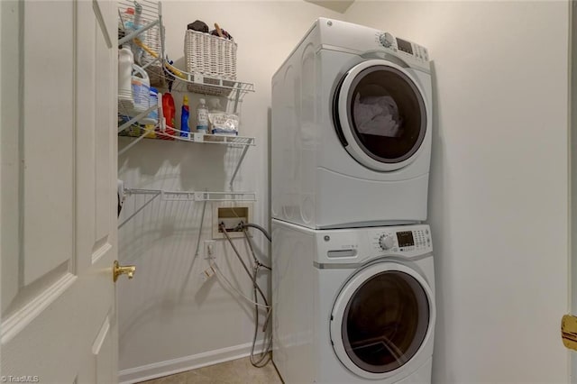 laundry area with estacked washer and dryer