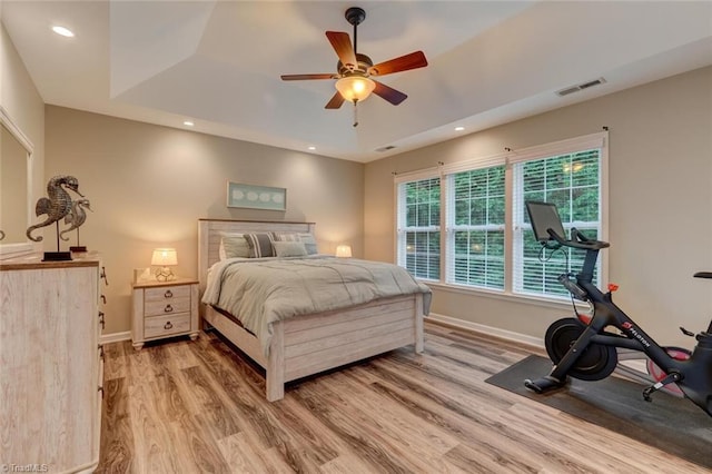 bedroom with light wood finished floors, baseboards, recessed lighting, and a ceiling fan