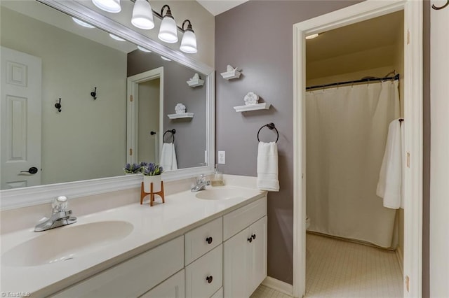 full bath featuring double vanity and toilet