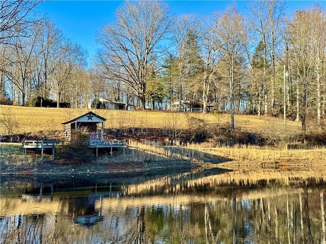 surrounding community featuring a water view