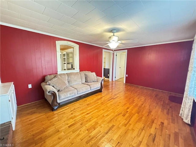 living room featuring hardwood / wood-style flooring and ornamental molding