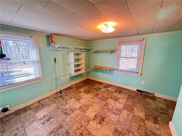 spare room featuring crown molding