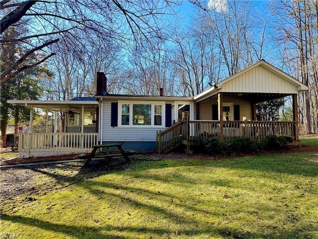 view of front of house with covered porch and a front yard