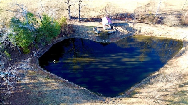 view of swimming pool with a water view